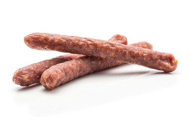 Three Hungarian dry sausages pepperoni isolated on white background smoked in natural casing mixed pork beef.