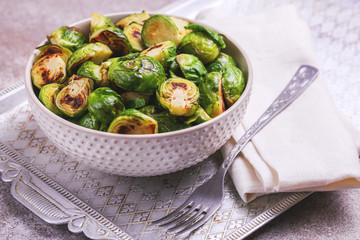 Vegetarian cuisine. Brussels Sprouts roasted with olive oil. Copyspace