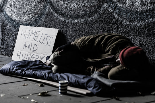 Homeless sleeping on the ground