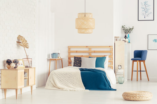 Blue bedroom interior with pouf