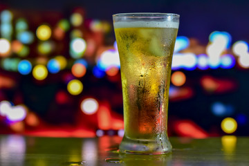 A glass of drink with bokeh background