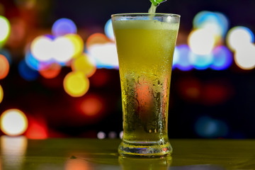 A glass of drink with bokeh background