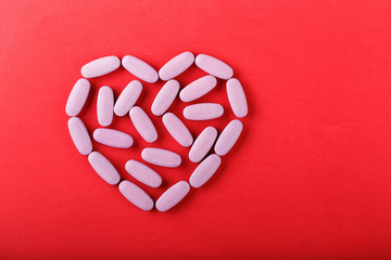 pills scattered as a heart