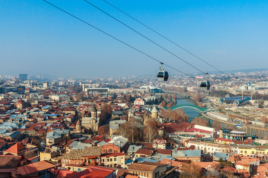 Tbilisi Old City Streets, Kura River, Holy Trinity Church And Cable Car In The Foreground, Georgia