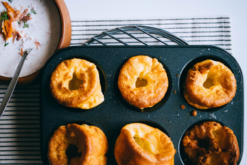 Yorkshire puddings with fish filling, in an old metal tray, top view