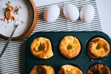 Yorkshire puddings with fish filling, in an old metal tray, top view