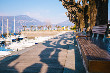 wooden walkway near the harbor. traditional and touristic village, Ranco, Lombardy, Lago Maggiore, Italy