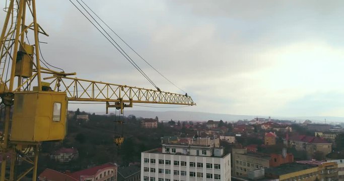 Aerial view: Cinematic shot of construction crane
