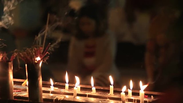Candles burning in a Shwedagon Pagoda. Yangon, Myanmar