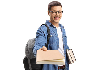 Student giving a book and smiling