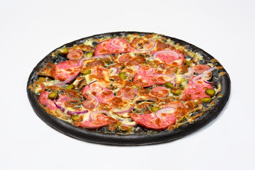 Black pizza with sausage, servelat and gherkins, pickles in white sauce with mozzarella cheese and mushrooms