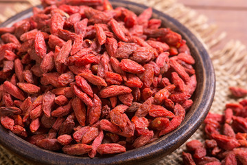 Goji berries in wooden spoon