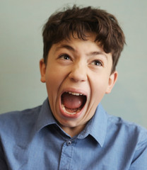 teenager boy scream grimace expression