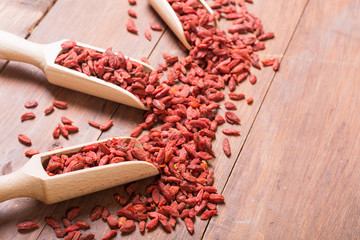 Goji berries in wooden spoon