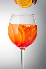 Summer refreshing faintly alcoholic cocktail Aperol spritz in a 