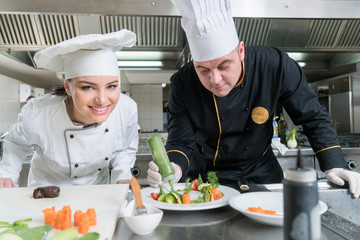 Chef Cooking, Cutting and preparing next plate