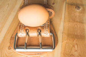 Fototapeta na wymiar Useful chicken eggs for sports nutrition next to the sports belt