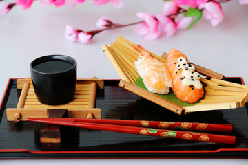 sushi set with chopsticks and japanese sake oriental