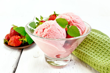 Ice cream strawberry in glass with berries on board