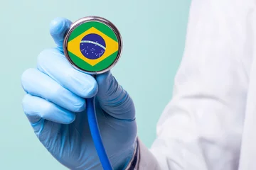 Window stickers Brasil Medicine in brazil is free and paid. Expensive medical insurance. Treatment of disease at the highest level Doctor holding a stethoscope in his hand