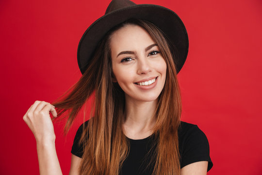 Close up of a smiling stylish girl wearing hat