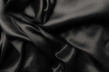 Naklejka na ściany i meble Elegant black satin silk with waves, abstract background