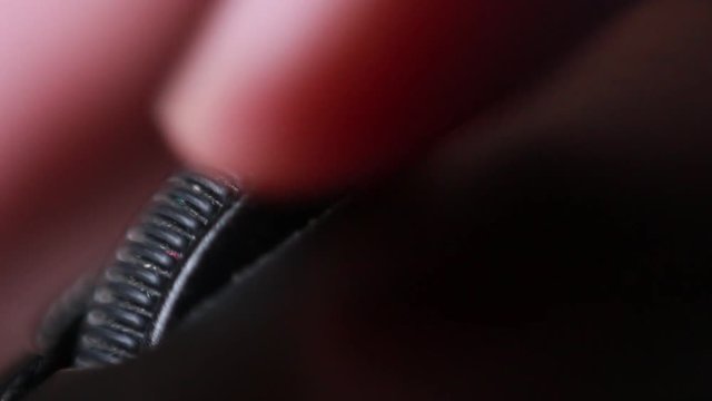 Moving computer mouse wheel. Extreme close up
