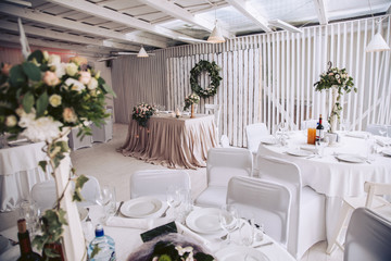Wedding celebration. Banquet decorated with decorators. Flower compositions and tables for guests with decor