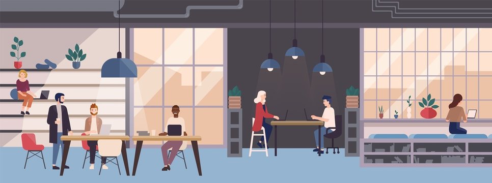 Smiling young people working on laptops in co-working area. Male and female freelance workers sitting at computers in modern open space or shared workplace. Colorful vector illustration in flat style.