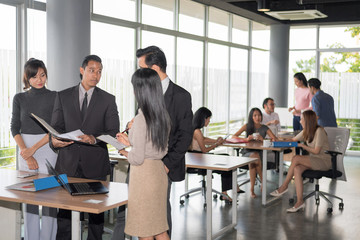 Business people are discussing their new projects.