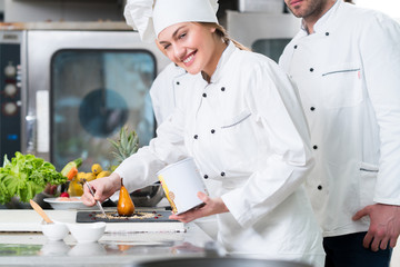Chef Cooking, Cutting and preparing next plate