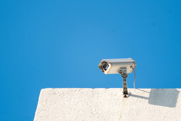 Closed Circuit Television Security camera On aluminum roof .