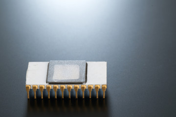 Electronic chip isolated on dark blue