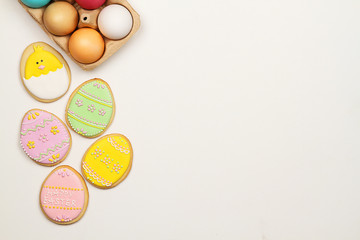 Easter cookies and Easter eggs on a white background