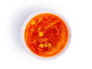 White plate with red home Ukrainian, Russian borscht, isolated on white background. National cuisine, soup with beetroot and cabbage. Abstract composition on the theme of food, top view