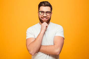 Portrait of a smiling bearded man in eyeglasses