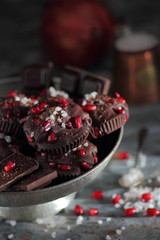 Chocolate bars with pomegranate fruits and sea salt