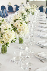living room decorated with white flowers for reception