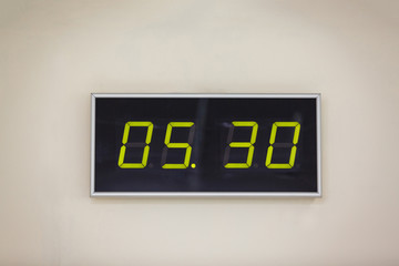 Black digital clock on a white background showing time 5 hours 30 minutes