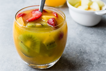 Tropical Cocktail Sangria with White Wine, Pineapple Juice, Strawberries, Kiwi, Mango and Apple.
