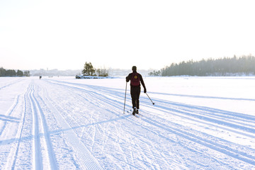 Female skier skiing on the ice of Lake Saimaa, Lappeenranta, Finland