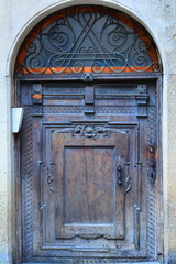 Wooden and metal ancient design door. Decoration, texture, close up