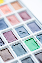 Set of colorful paint in plastic white box