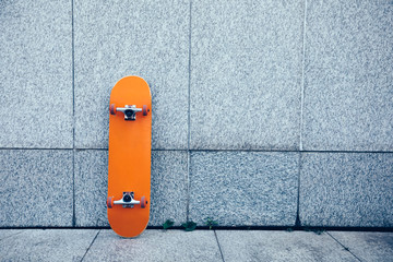 one skateboard against wall © lzf