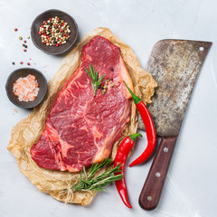 Raw beef steak with spices ready for cooking dinner
