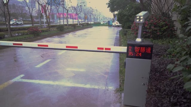 The barrier with a video camera in the parking lot
