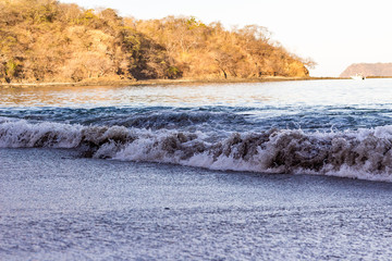 Waves on the beach at dusk in Costa Rica