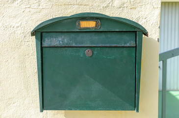 green mailbox on the wall