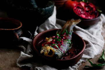 Grilled trout with pomegranate sauce.style rustic