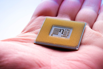 technology cyber electronic concept. cpu microprocessor chip in hand
